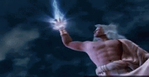 A Person Is Holding A Lightning Bolt In Their Hand While Standing In Front Of A Cloudy Sky . GIF