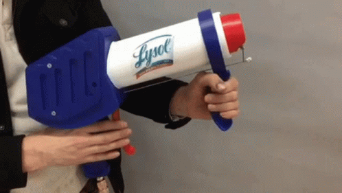 A Person Is Holding A Lysol Spray Gun GIF