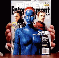 A Person Is Holding A Magazine That Says X-Men GIF