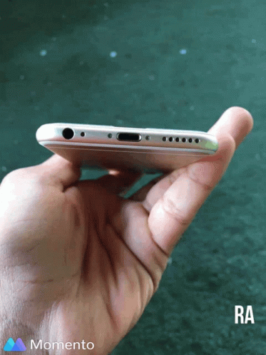 A Person Is Holding A Phone In Their Hand And The Bottom Of The Phone Is Visible GIF