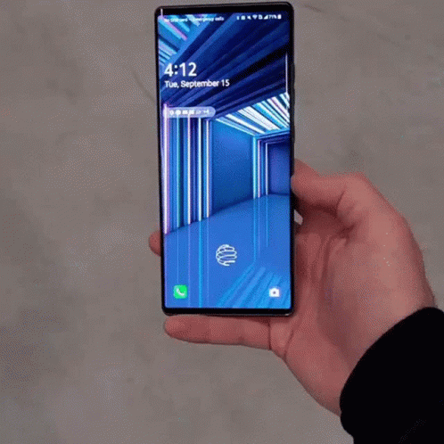 A Person Is Holding A Phone That Says 4:12 Tuesday September 15Th GIF