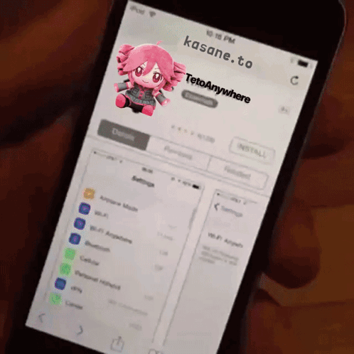 A Person Is Holding A Phone That Says Kasane.to GIF