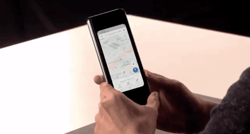 A Person Is Holding A Phone With A Map On It GIF