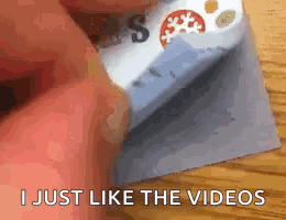 A Person Is Holding A Piece Of Paper That Says `` I Just Like The Videos '' . GIF