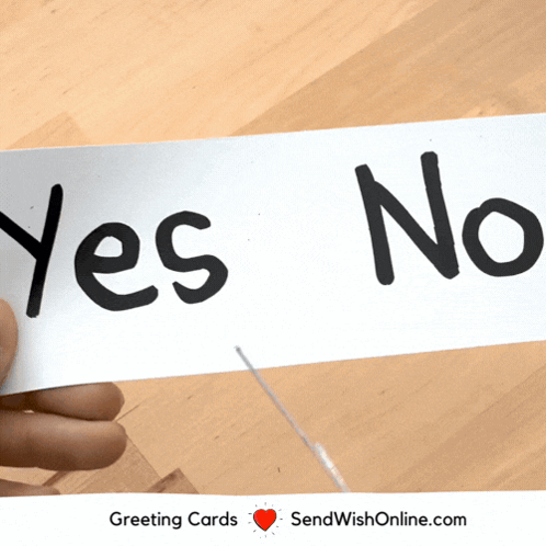 A Person Is Holding A Piece Of Paper That Says " Yes No " GIF