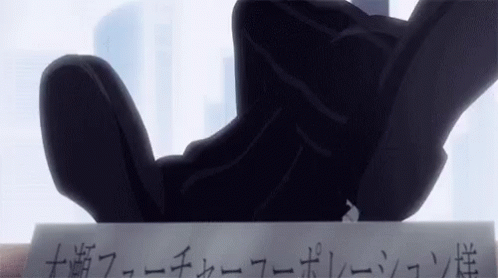 A Person Is Holding A Piece Of Paper With Japanese Writing On It . GIF