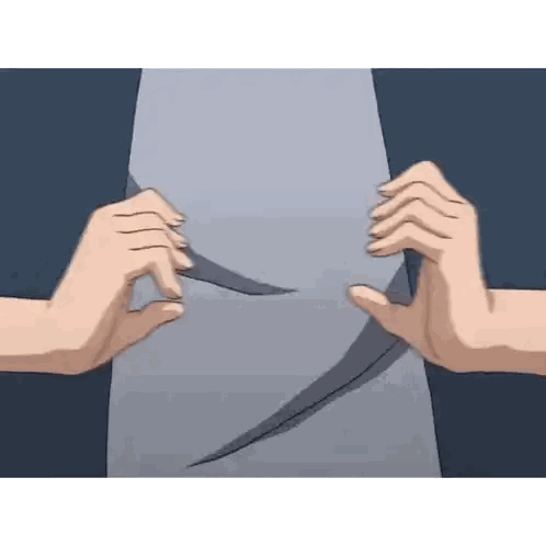 a person is holding a piece of paper with their hands .