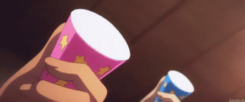 A Person Is Holding A Pink Cup With A Cat On It . GIF