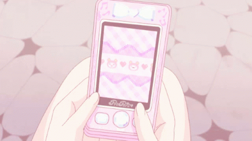 A Person Is Holding A Pink Phone That Says Pi-Rite On The Front GIF