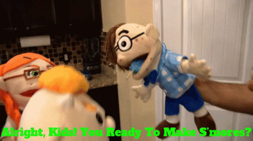 A Person Is Holding A Puppet That Says ' Alright Kids You Ready To Make S'mores ' On It GIF