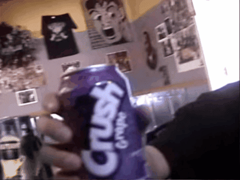 A Person Is Holding A Purple Crush Grape Soda GIF
