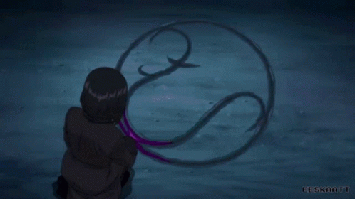 A Person Is Holding A Purple Object In Their Hand In A Purple Light . GIF