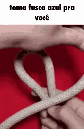 A Person Is Holding A Rope In Their Hands And Making A Heart Shape . GIF