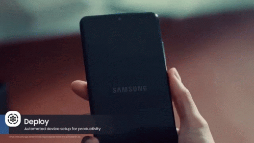 A Person Is Holding A Samsung Phone In Their Right Hand GIF