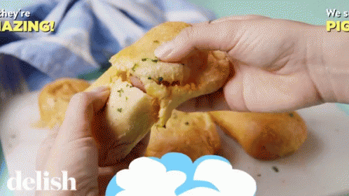 A Person Is Holding A Sandwich With The Words They 'Re Amazing On The Bottom GIF