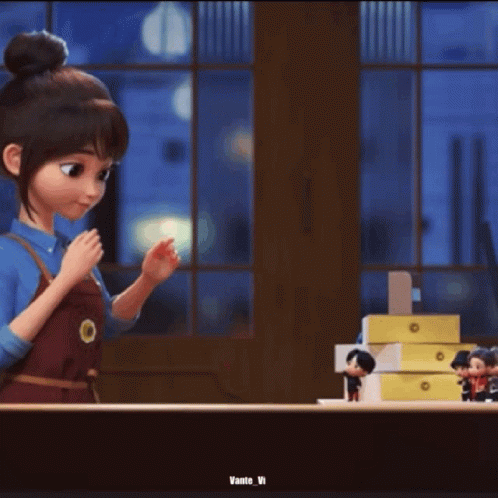 A Person Is Holding A Small Toy In Their Hand . GIF