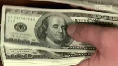 A Person Is Holding A Stack Of 100 Dollar Bills With Their Finger . GIF