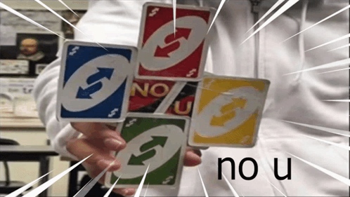 A Person Is Holding A Stack Of Uno Cards In Their Hands GIF