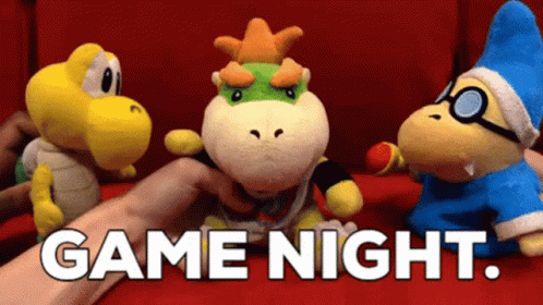 A Person Is Holding A Stuffed Animal With The Words Game Night Written On The Bottom GIF