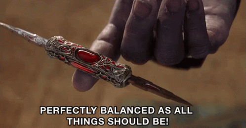 A Person Is Holding A Sword With The Words Perfectly Balanced As All Things Should Be GIF