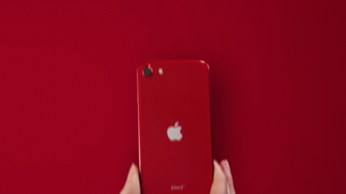 A Person Is Holding A White Apple Iphone GIF