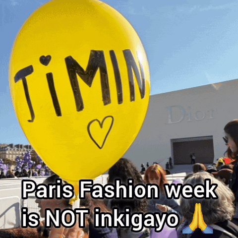 A Person Is Holding A Yellow Balloon That Says ' Jimin ' On It GIF