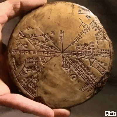 Person Holding Ancient Stone With Writing GIF