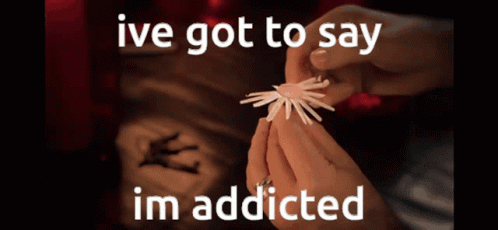 A Person Is Holding Something In Their Hands With The Words Ive Got To Say Im Addicted GIF