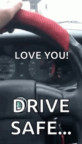 A Person Is Holding The Steering Wheel Of A Car With The Words `` Love You ! Drive Safe . '' GIF