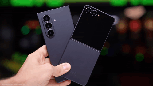 A Person Is Holding Two Cell Phones One Of Which Is A Samsung Flip Phone GIF