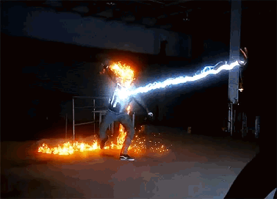 A Person Is Kicking A Ball Of Fire With Lightning Coming From It GIF