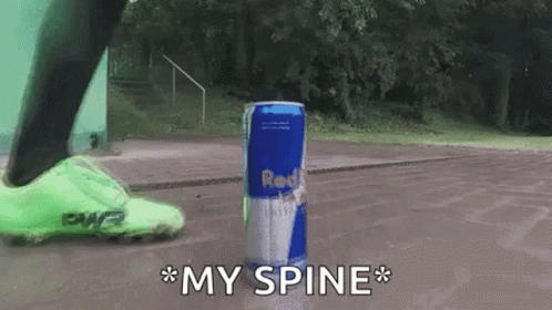 A Person Is Kicking A Can Of Red Bull In The Air GIF