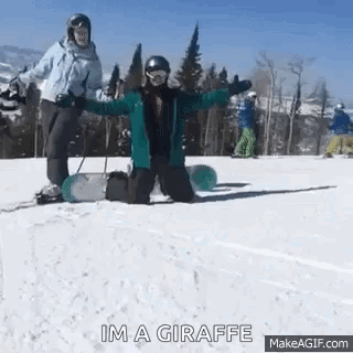 A Person Is Kneeling Down On A Snowboard In The Snow While Another Person Stands Behind Them . GIF