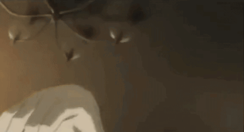 A Person Is Laying On A Bed With Their Head On Another Person 'S Shoulders . GIF