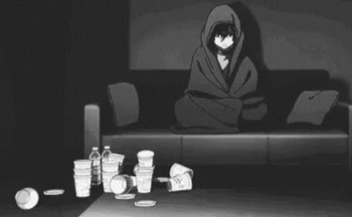 A Person Is Laying On A Couch In A Living Room With A Lot Of Trash On The Floor . GIF