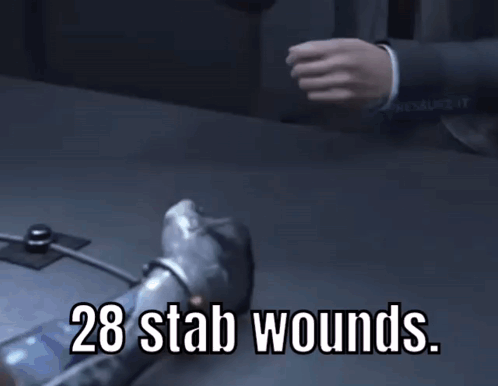 A Person Is Laying On A Table With The Words 28 Stab Wounds Written On It GIF