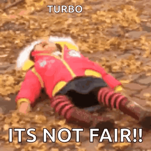 A Person Is Laying On The Ground With The Words Turbo Its Not Fair GIF