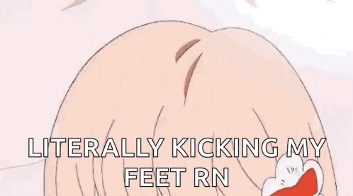 A Person Is Laying On Their Stomach On A Bed In A Room With A Desk And A Table . GIF