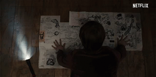 A Person Is Looking At A Map With A Netflix Logo Behind Them GIF