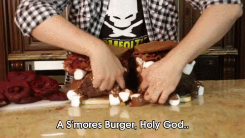 A Person Is Making A S'mores Burger With Marshmallows And Bacon GIF