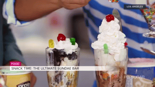 A Person Is Making A Sundae With Gummy Bears On Top GIF