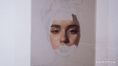 A Person Is Painting A Portrait Of A Woman With A Brush . GIF