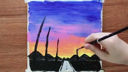 A Person Is Painting A Sunset Over A Road With A Brush GIF
