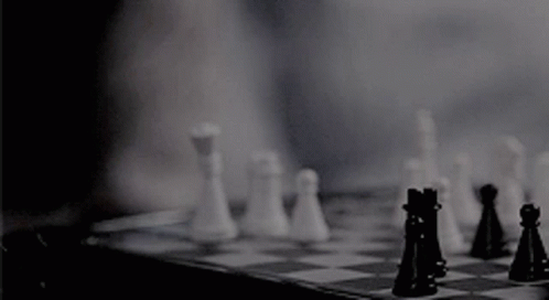 A Person Is Playing A Game Of Chess With Their Fingers . GIF