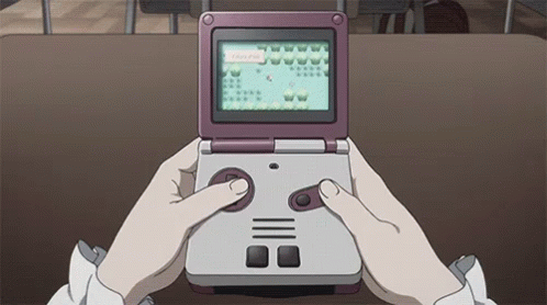 A Person Is Playing A Video Game On A Handheld Console . GIF