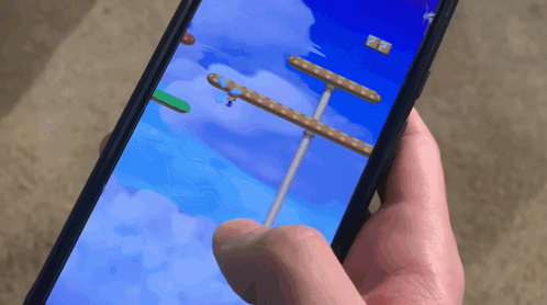 A Person Is Playing A Video Game On Their Phone With A Score Of 27 GIF