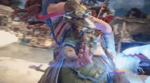 A Person Is Playing A Video Game With A Blue Light Coming Out Of Their Mouth . GIF