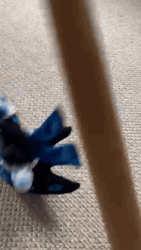 A Person Is Playing With A Toy On The Floor GIF