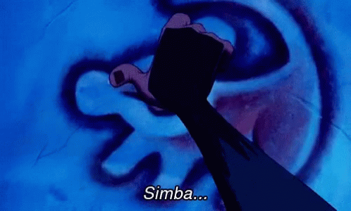 A Person Is Pointing At A Drawing Of A Lion And The Word Simba Is Below It GIF