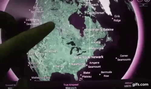 A Person Is Pointing At A Map Of The United States And Canada GIF